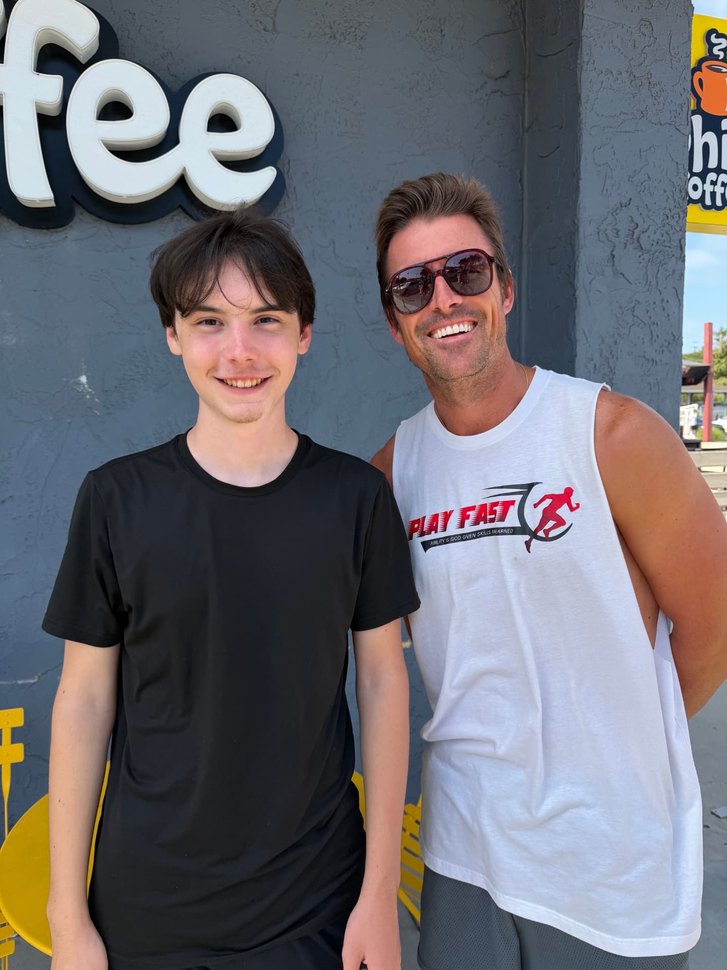 Remy Lievens with Sean Canfield, a former NFL quarterback and firefighter